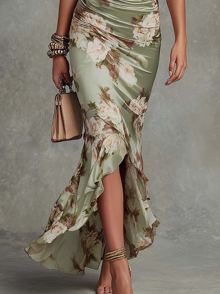 Anna - Asymmetrical long dress in green satin with V-neck, flared ruffled sleeves, and floral pattern